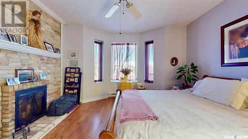 304 2925 14Th Avenue, Regina, SK - Indoor Photo Showing Bedroom With Fireplace