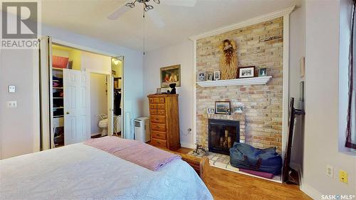 304 2925 14Th Avenue, Regina, SK - Indoor Photo Showing Bedroom With Fireplace