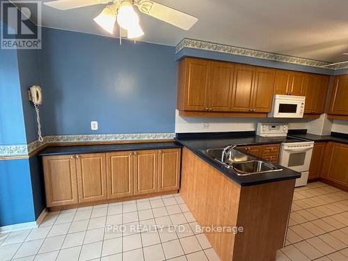 74 - 2275 Credit Valley Road, Mississauga, ON - Indoor Photo Showing Kitchen With Double Sink