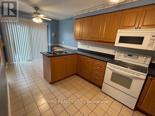 74 - 2275 Credit Valley Road, Mississauga, ON - Indoor Photo Showing Kitchen With Double Sink