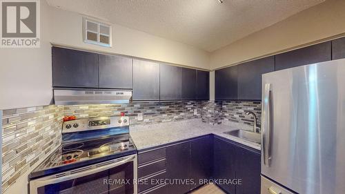 203 - 745 Davis Drive, Kingston (East Gardiners Rd), ON - Indoor Photo Showing Kitchen With Stainless Steel Kitchen With Upgraded Kitchen