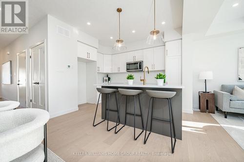 5 - 41 Fieldstone Lane, Centre Wellington, ON - Indoor Photo Showing Kitchen With Upgraded Kitchen