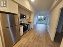 206 - 202 Burnhamthorpe Road E, Mississauga, ON  - Indoor Photo Showing Kitchen With Stainless Steel Kitchen 