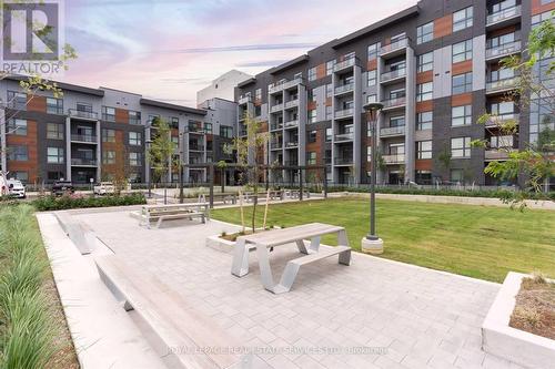 418 - 95 Dundas Street W, Oakville, ON - Outdoor With Balcony With Facade