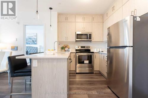 418 - 95 Dundas Street W, Oakville, ON - Indoor Photo Showing Kitchen With Stainless Steel Kitchen With Upgraded Kitchen