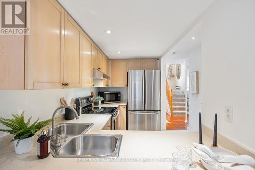 #105 - 50 Merchant Lane, Toronto, ON - Indoor Photo Showing Kitchen With Double Sink