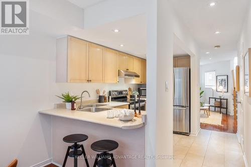 #105 - 50 Merchant Lane, Toronto, ON - Indoor Photo Showing Kitchen With Double Sink