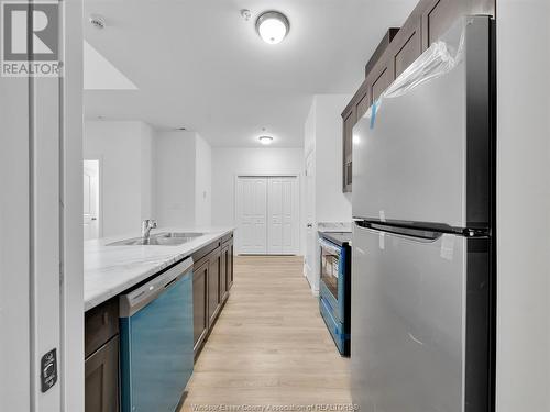 1888 Westview Park Boulevard Unit# 416, Lasalle, ON - Indoor Photo Showing Kitchen With Double Sink