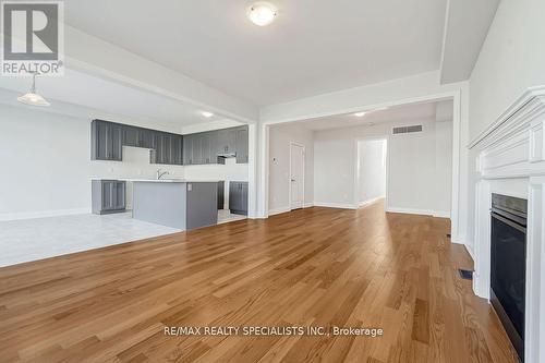 865 Knights Lane, Woodstock, ON - Indoor Photo Showing Kitchen With Fireplace