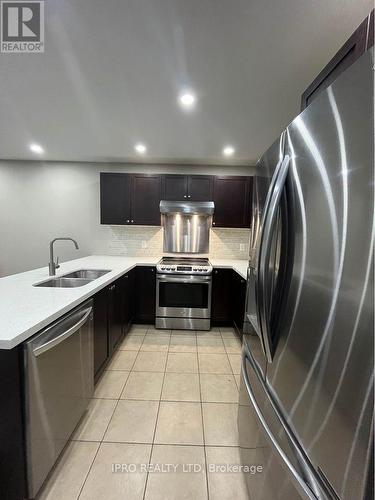 141 Weston Drive, Milton, ON - Indoor Photo Showing Kitchen With Double Sink