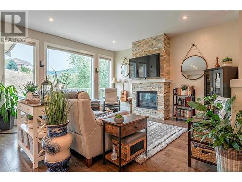 237 Kicking Horse Place, Vernon, BC - Indoor Photo Showing Living Room With Fireplace