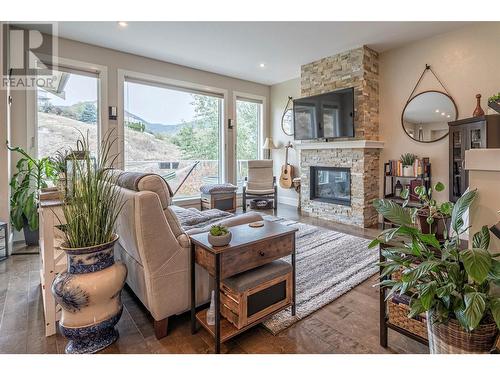 237 Kicking Horse Place, Vernon, BC - Indoor Photo Showing Living Room With Fireplace