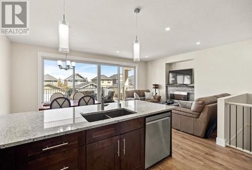 1274 Bergamot Avenue, Kelowna, BC - Indoor Photo Showing Kitchen With Fireplace With Double Sink