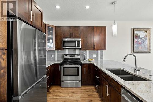 1274 Bergamot Avenue, Kelowna, BC - Indoor Photo Showing Kitchen With Stainless Steel Kitchen With Double Sink With Upgraded Kitchen