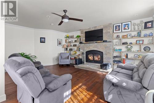 75-77 Conrans Road, Harbour Main, NL - Indoor Photo Showing Living Room With Fireplace