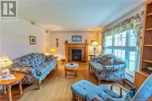 77 Pond Shore Road, Sackville, NB - Indoor Photo Showing Living Room With Fireplace