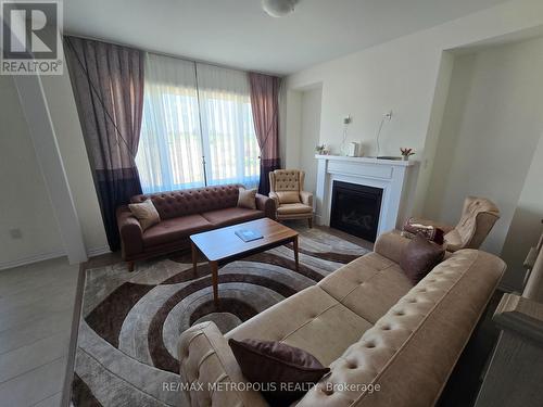 10 Ed Ewert Avenue, Clarington, ON - Indoor Photo Showing Living Room With Fireplace