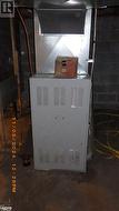 Utility room with oil fired heating unit - 