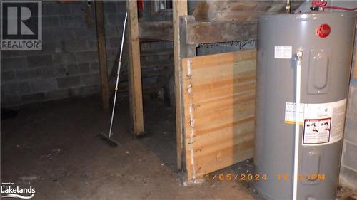 Utility room featuring water heater - 109 Blackstone Crane Lake Road, Seguin, ON - Indoor Photo Showing Basement