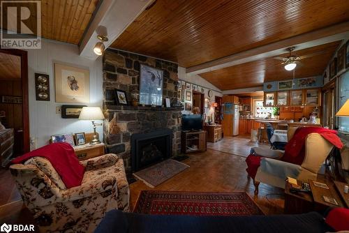 1067 B Shawenegog Lake Lane, Cloyne, ON - Indoor Photo Showing Living Room With Fireplace