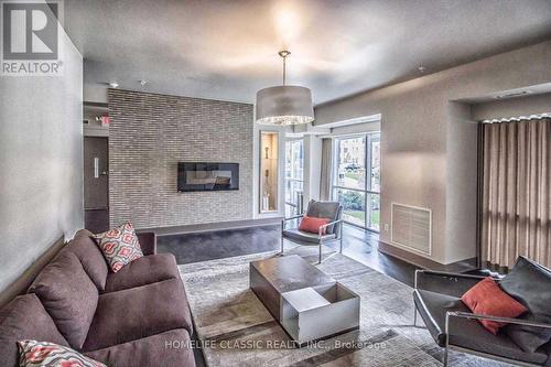 203 - 570 Lolita Gardens, Mississauga, ON - Indoor Photo Showing Living Room With Fireplace