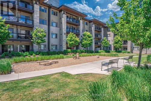 203 - 570 Lolita Gardens, Mississauga, ON - Outdoor With Balcony With Facade