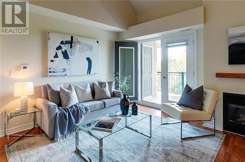 302 - 8 Brandy Lane Drive, Collingwood, ON - Indoor Photo Showing Living Room With Fireplace