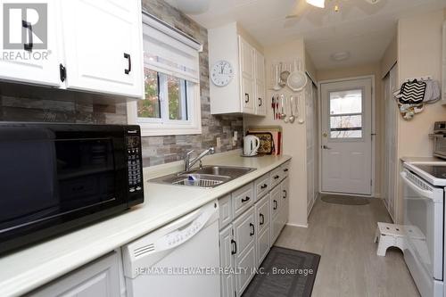 83 Dunes Drive, Lambton Shores (Grand Bend), ON - Indoor Photo Showing Kitchen With Double Sink