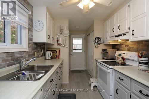 83 Dunes Drive, Lambton Shores (Grand Bend), ON - Indoor Photo Showing Kitchen With Double Sink