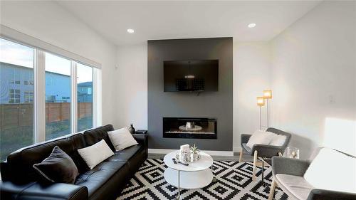 80 Cornerstone Heights, Winnipeg, MB - Indoor Photo Showing Living Room With Fireplace