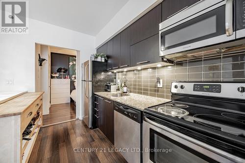 106 - 38 Joe Shuster Way, Toronto, ON - Indoor Photo Showing Kitchen With Stainless Steel Kitchen