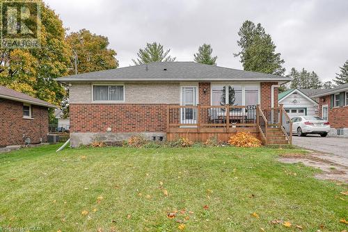 View of front facade featuring a front yard and cooling unit - 824 Devonshire Avenue, Woodstock, ON - Outdoor With Deck Patio Veranda