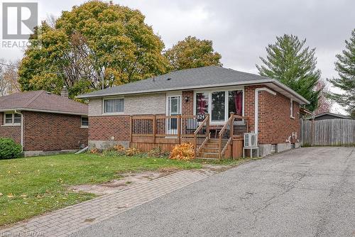 Ranch-style home featuring a front lawn - 824 Devonshire Avenue, Woodstock, ON - Outdoor