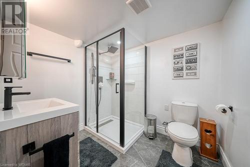 Bathroom with vanity, toilet, and an enclosed shower - 824 Devonshire Avenue, Woodstock, ON - Indoor Photo Showing Bathroom