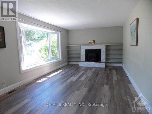 10617 Maple Street, North Dundas, ON - Indoor Photo Showing Living Room With Fireplace