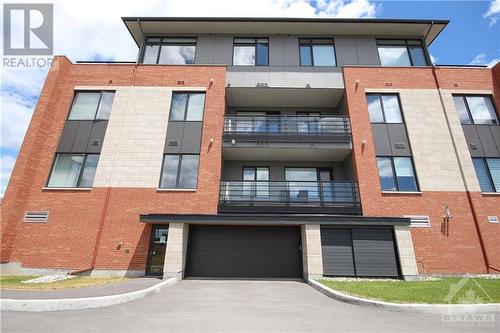 Entrance to underground parking - 180 Boundstone Way Unit#203, Ottawa, ON - Outdoor With Balcony With Facade