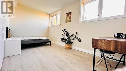 Bedroom with light hardwood / wood-style flooring - 783 Autumn Willow Drive Unit# Lower, Waterloo, ON - Indoor Photo Showing Laundry Room