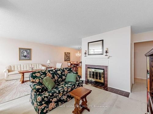 1901-3151 Bridletowne Circ, Toronto, ON - Indoor Photo Showing Living Room With Fireplace