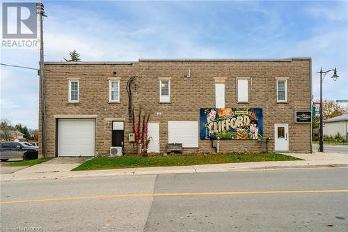 side view with garage door - 3 Elora Street, Clifford, ON 