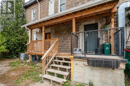 View of exterior entry featuring cooling unit and covered porch - 3 Elora Street, Clifford, ON 