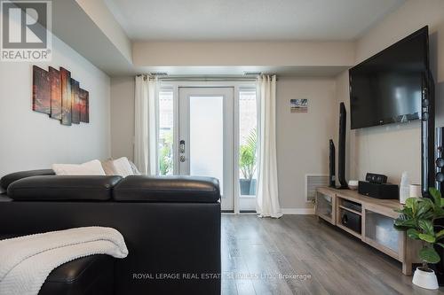 111 - 1045 Nadalin Heights, Milton, ON - Indoor Photo Showing Living Room