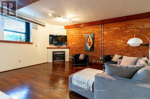 13 - 357 Hunter Street W, Hamilton, ON - Indoor Photo Showing Living Room With Fireplace