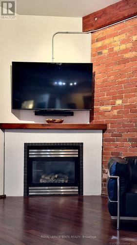 13 - 357 Hunter Street W, Hamilton, ON - Indoor Photo Showing Living Room With Fireplace