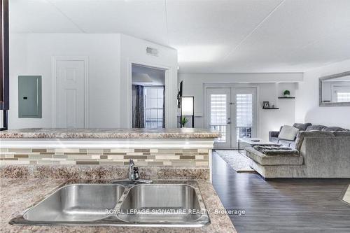 208-1340 Main St E, Milton, ON - Indoor Photo Showing Kitchen With Double Sink