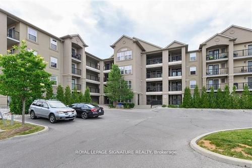 208-1340 Main St E, Milton, ON - Outdoor With Balcony With Facade