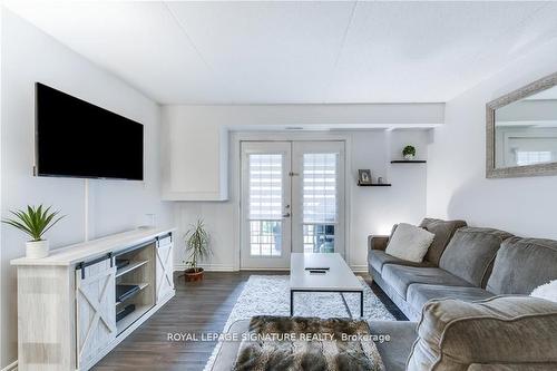 208-1340 Main St E, Milton, ON - Indoor Photo Showing Living Room