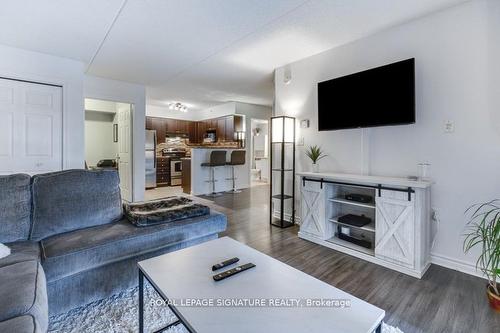 208-1340 Main St E, Milton, ON - Indoor Photo Showing Living Room