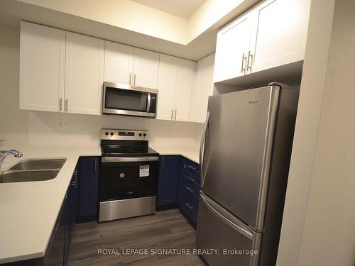 107-1573 Rose Way, Milton, ON - Indoor Photo Showing Kitchen With Stainless Steel Kitchen With Double Sink