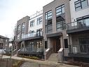 107-1573 Rose Way, Milton, ON  - Outdoor With Balcony With Facade 