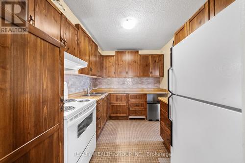 1401 - 4091 Sheppard Avenue E, Toronto, ON - Indoor Photo Showing Kitchen With Double Sink